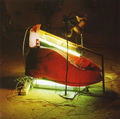 George Lappas, Luminous shoe, 1997, iron, photographic membrane, lights, 0.50 x 0.70 x 0.40 m