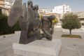 Θύμιος Πανουργιάς, Μνημείο Πεσόντων, 2006, Πλατεία Μ. Δημάδη, Αγρίνιο, χυτός και συγκολλημένος ορείχαλκος, 170 x 225 x 165 εκ.