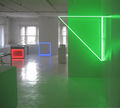 Stephen Antonakos, Installation shot at 435 West Broadway, New York, NY, 2015. Left to right: "Neon Desk" 1990, ed. of 3, Neon, metal, electric outlet, 34" x 77" x 36". "On the Floor Corner Blue Neon Square" 1974, Neon, 36" x 36". "Triangle EGL Green Inside Corner Neon" 1973, Neon, 60" x 60" (16" out from corner, top is 7΄3" up from the floor), Photography by Alexander Marsh
