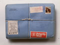 Stephen Antonakos, "Package Sealed July 1975, to be Opened July 2000" 1975, series of 40, Paper, stamps, ink, twine, 8 1/2"h x 11"w x 2"d, All distributed, Photography by D. James Dee