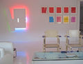 Stephen Antonakos, Installation shot at 435 West Broadway, New York, NY, 2010. "Departure" 2007, Neon, white paint, Versacel, 61"h x 52 1/2"w x 5"d. A selection of Spring and Winter Series drawings, 2006 - 2009, Photography by Alexander Marsh
