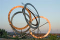 Γιώργος Ζογγολόπουλος, Ολυμπιακοί Κύκλοι, 2002, ανοξείδωτος χάλυβας, ύψος 15 μέτρα, Διεθνής Αερολιμένας "Ελ. Βενιζέλος"
